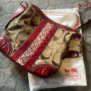 Women’s red and tan coach shoulder bag
